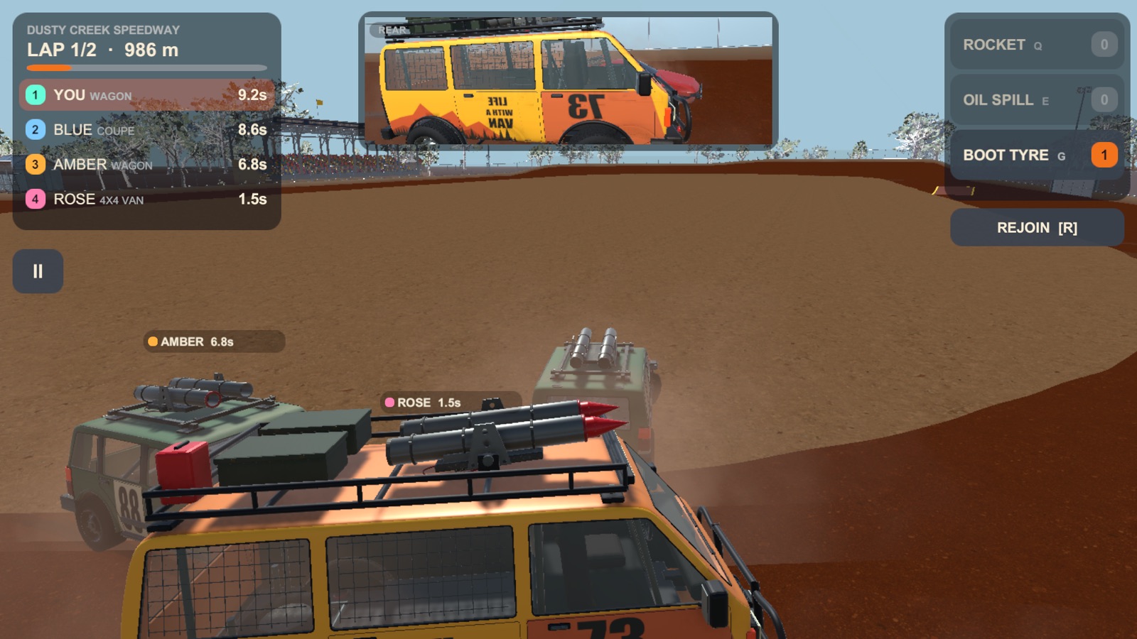 A pack of cars fighting for the trailer on the red dirt at Dusty Creek Speedway